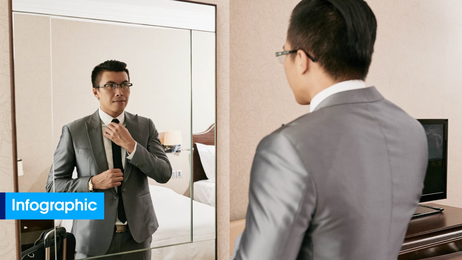 man fixing his tie