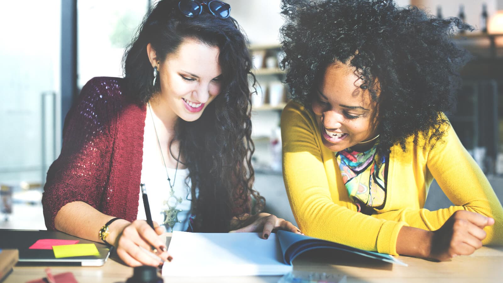 Two women working together