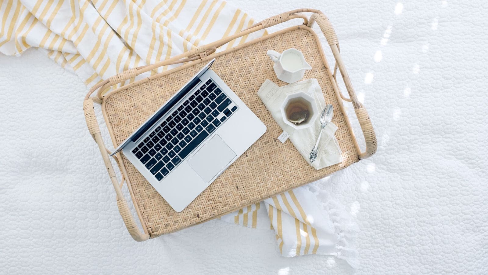 Laptop and coffee in bed