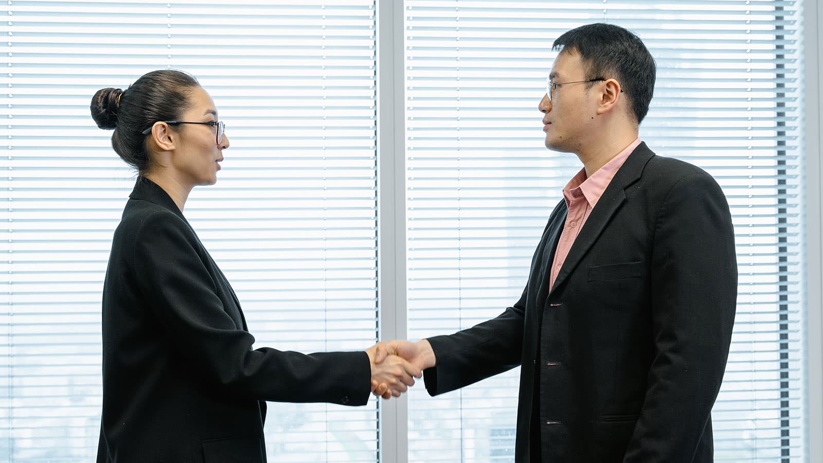 Man and woman shaking hands 