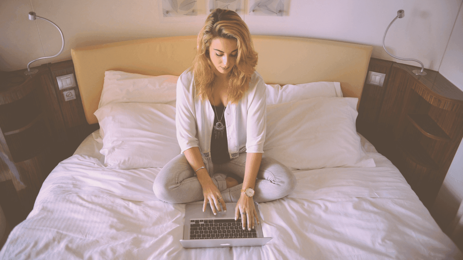 Girl on bed with computer