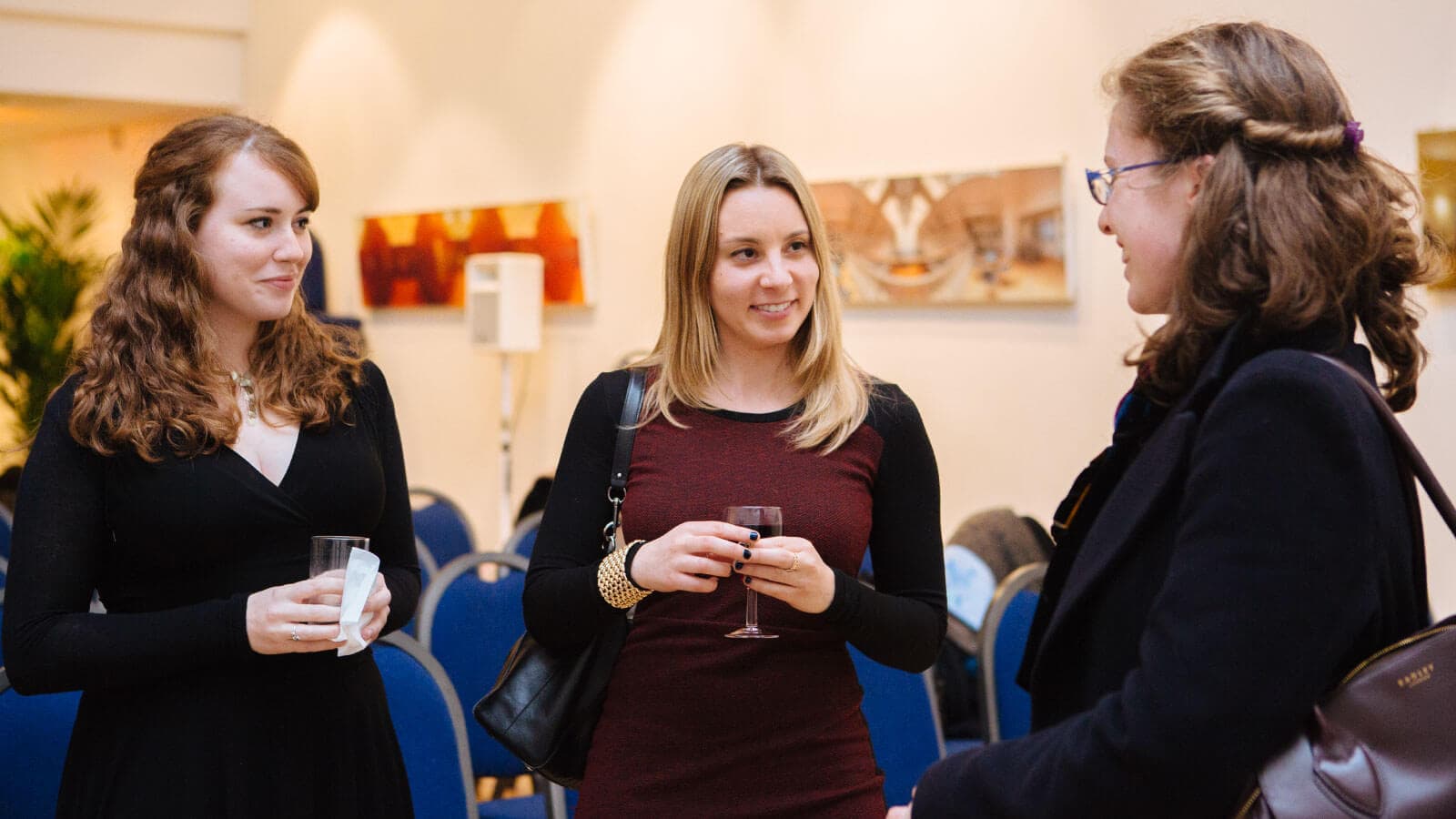 Group of women talking at a networking event