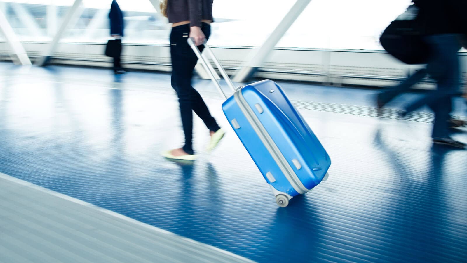 Rolling luggage in airport