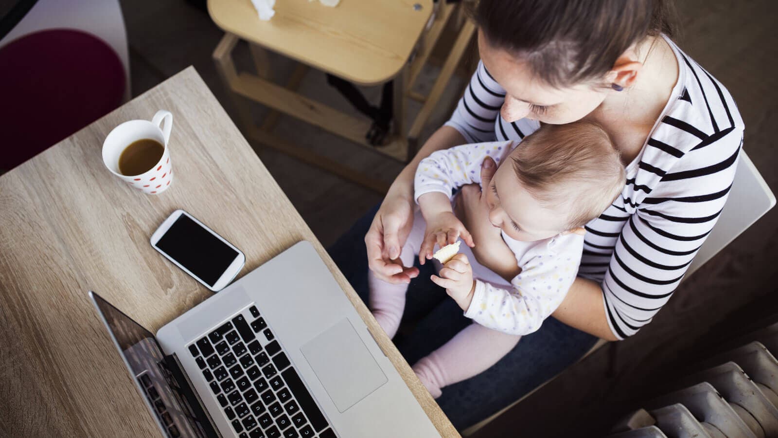 Mom working with baby on lap
