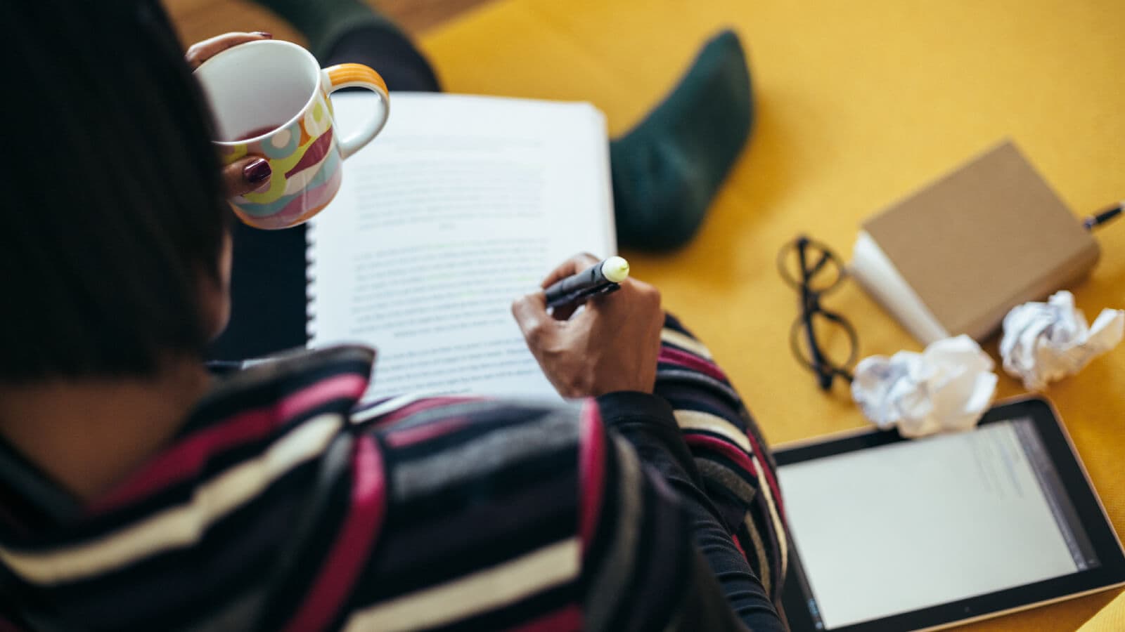 Woman writing and editing