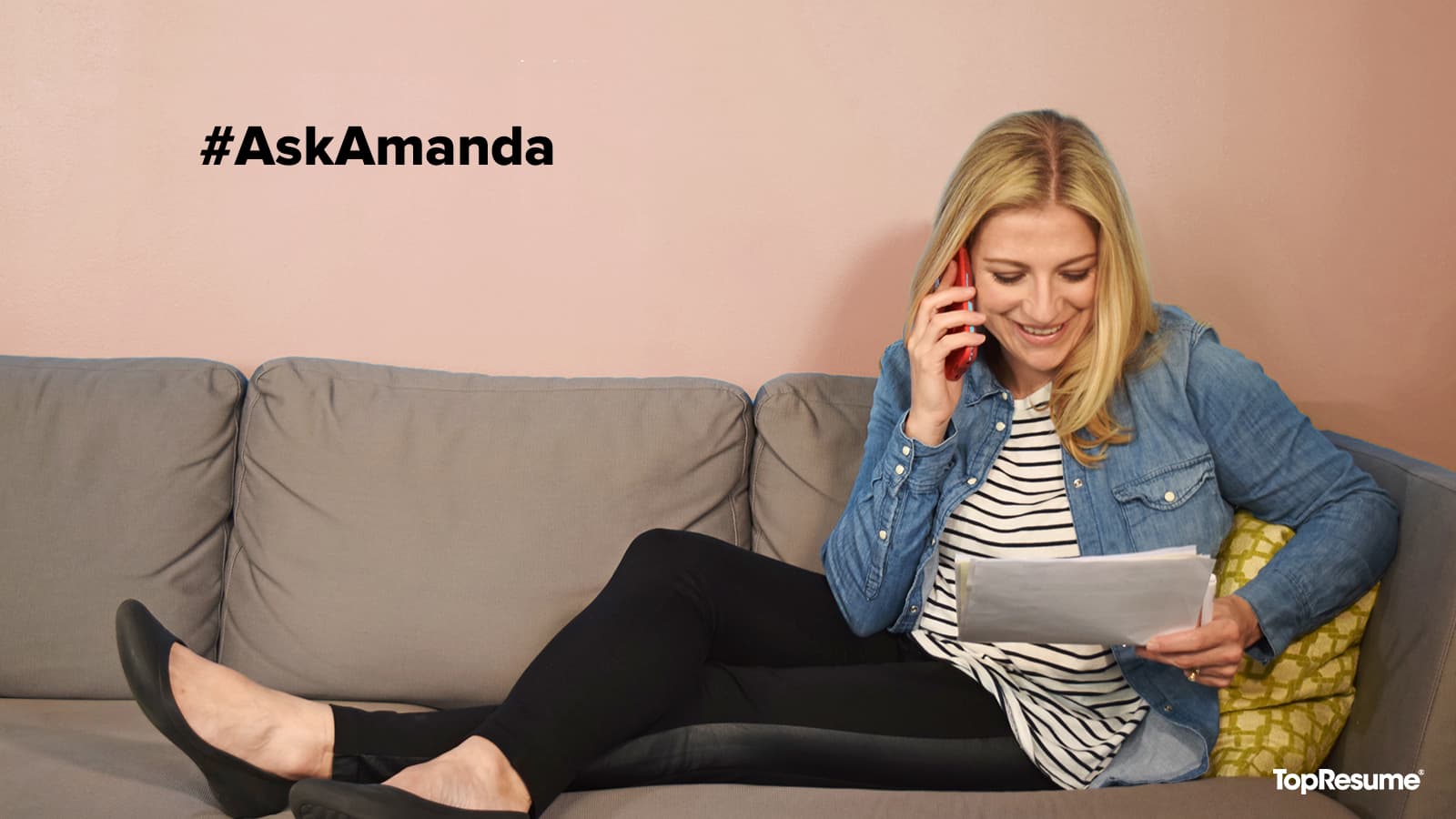 woman on the phone looking at a piece of paper
