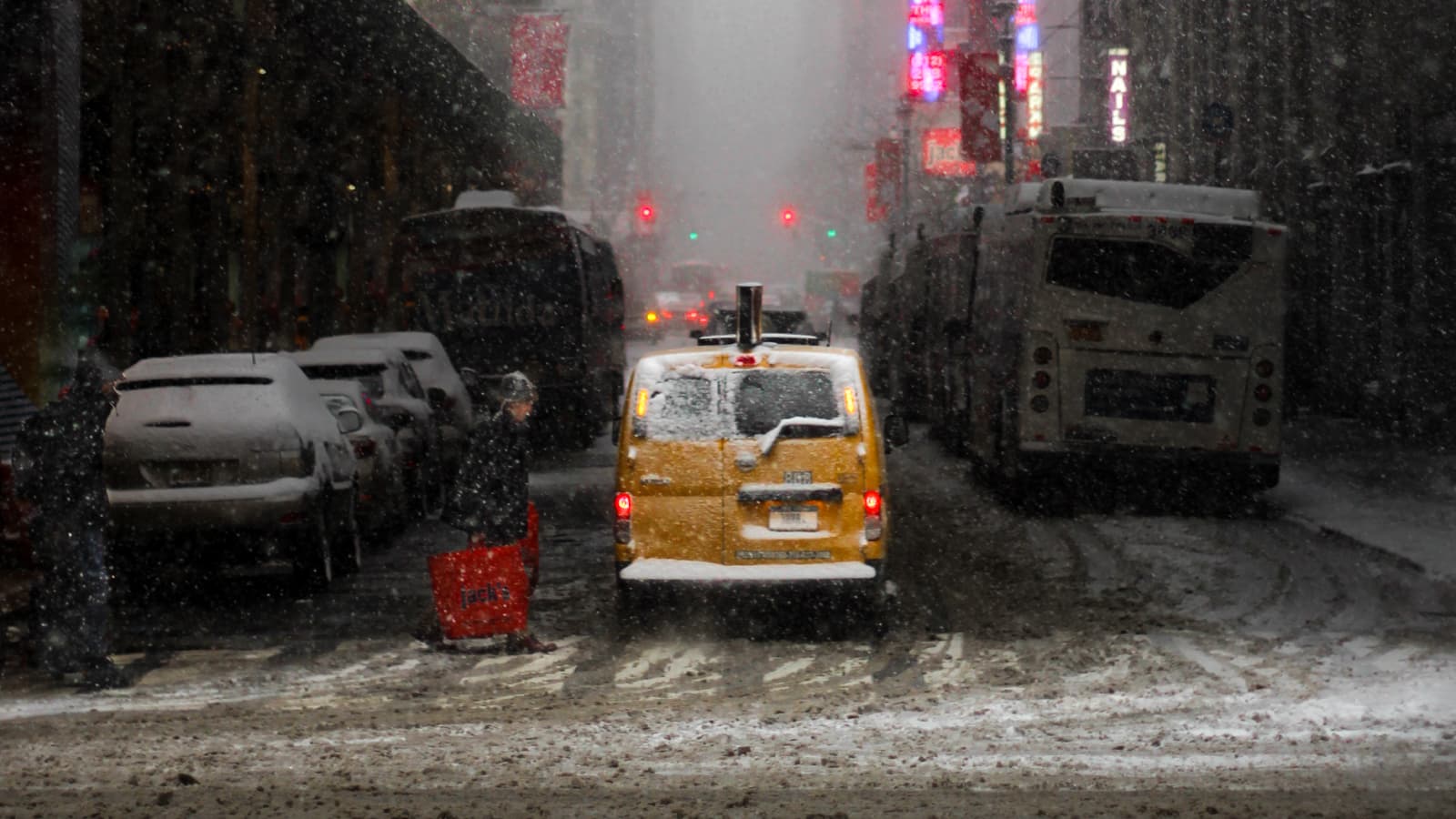 Person walking through a snow storm