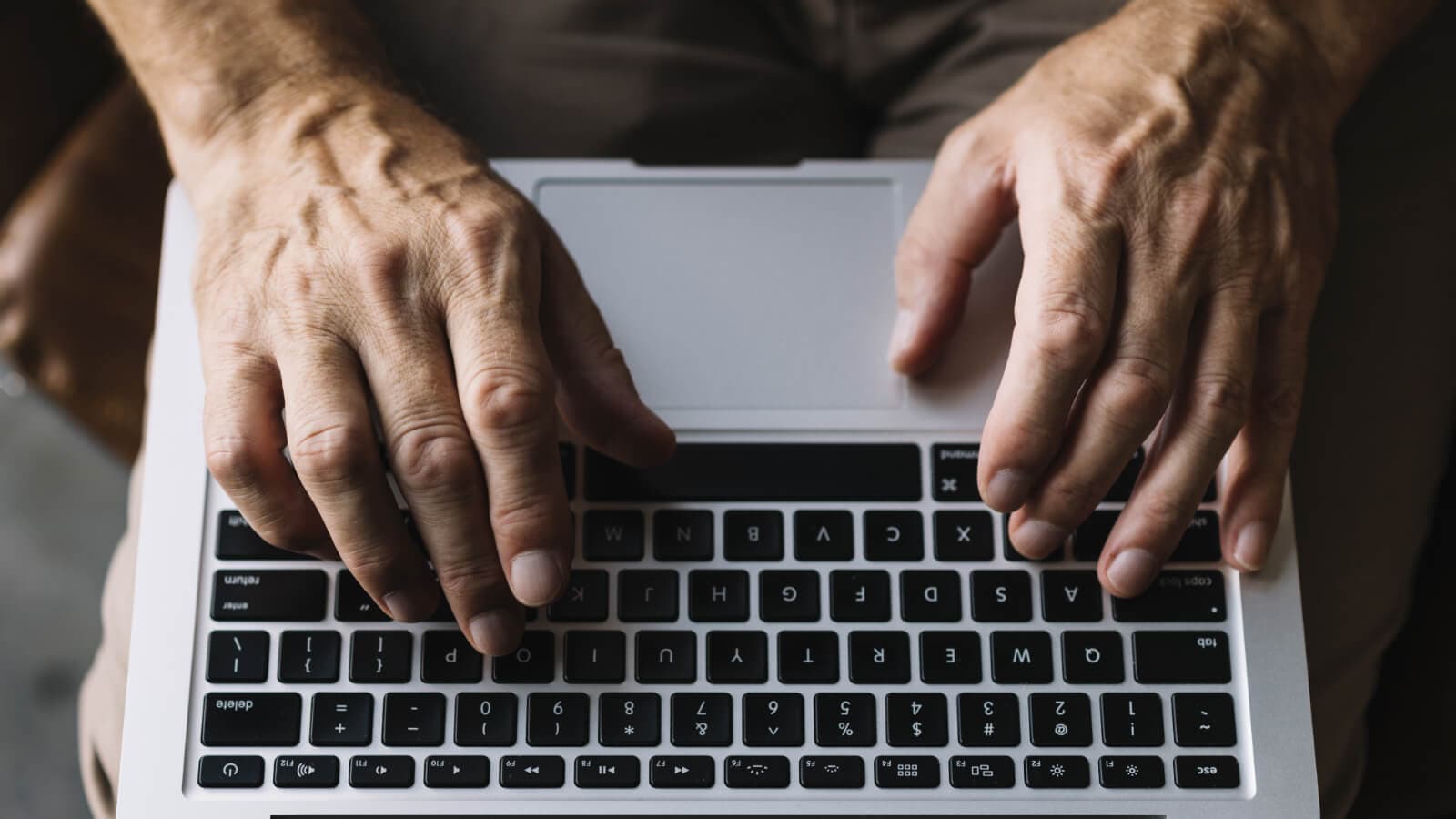 older man typing