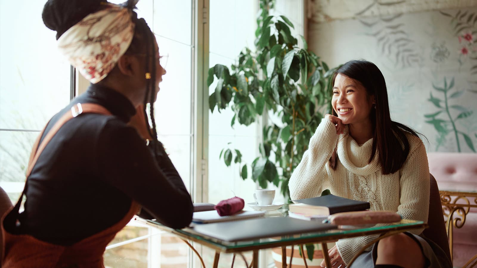 Two women chatting over a table