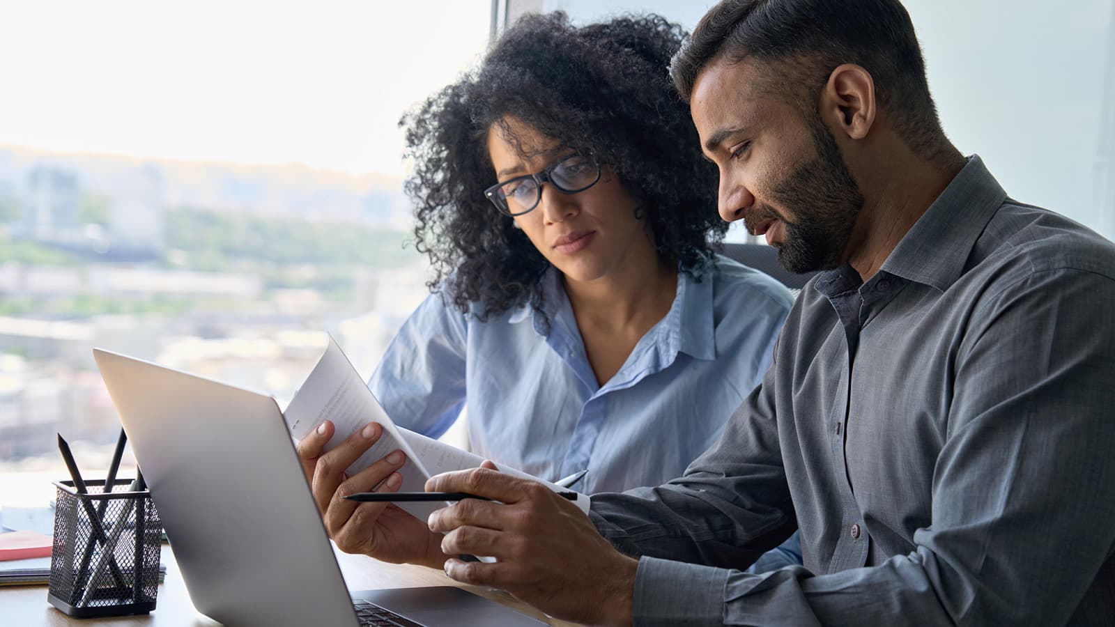 Man and woman perusing document