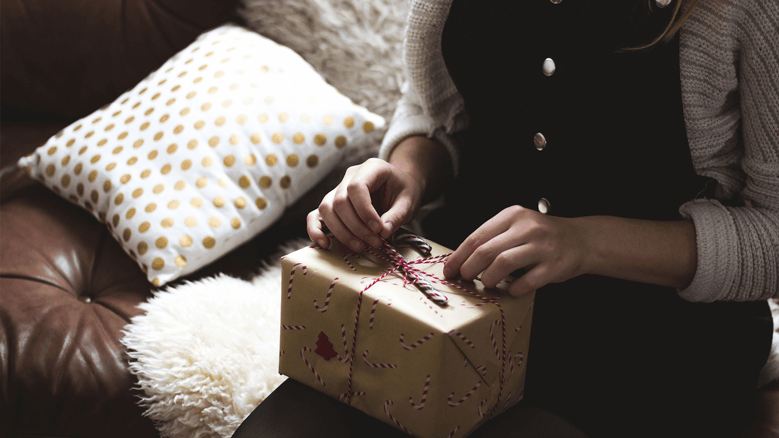 someone unwrapping a gift