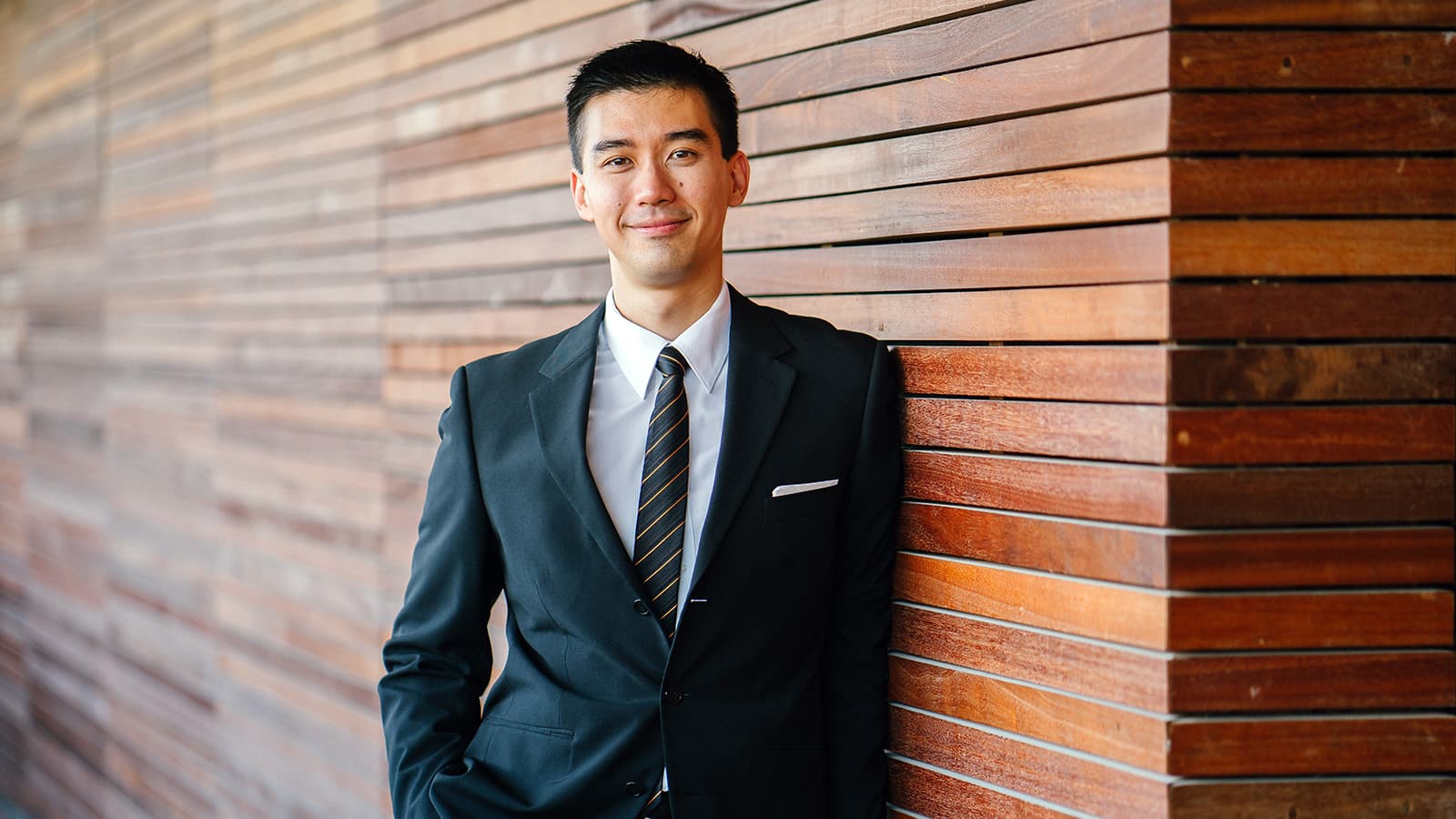 Man in suit smiling confidently