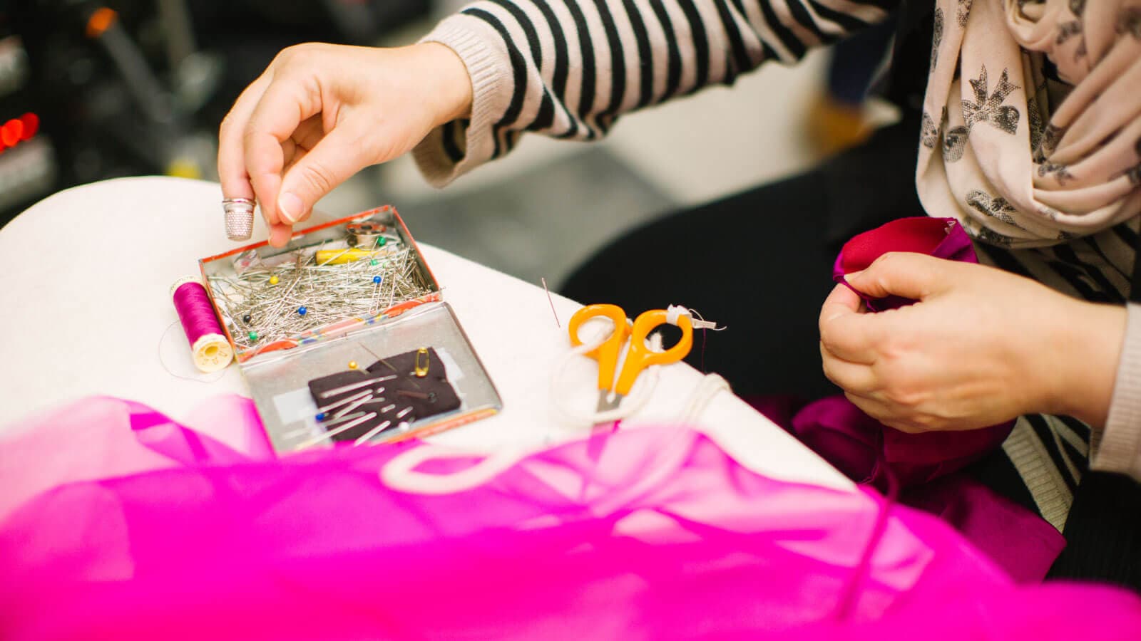 woman tailoring a dress
