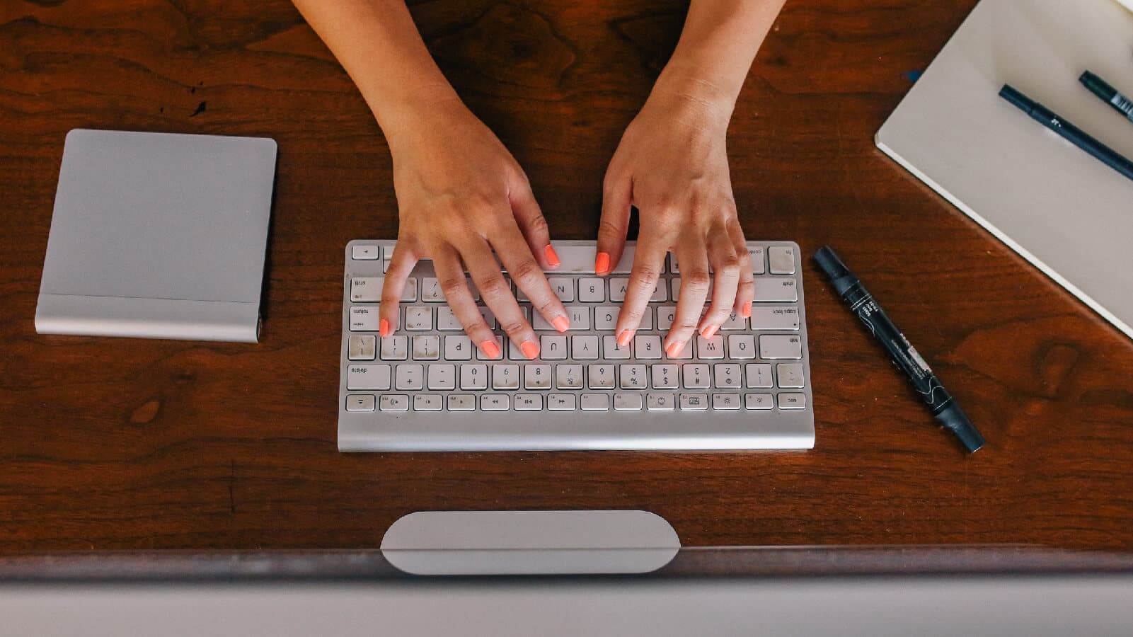 person typing on their keyboard