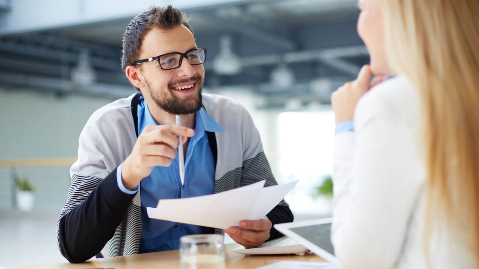 Man interviewing woman