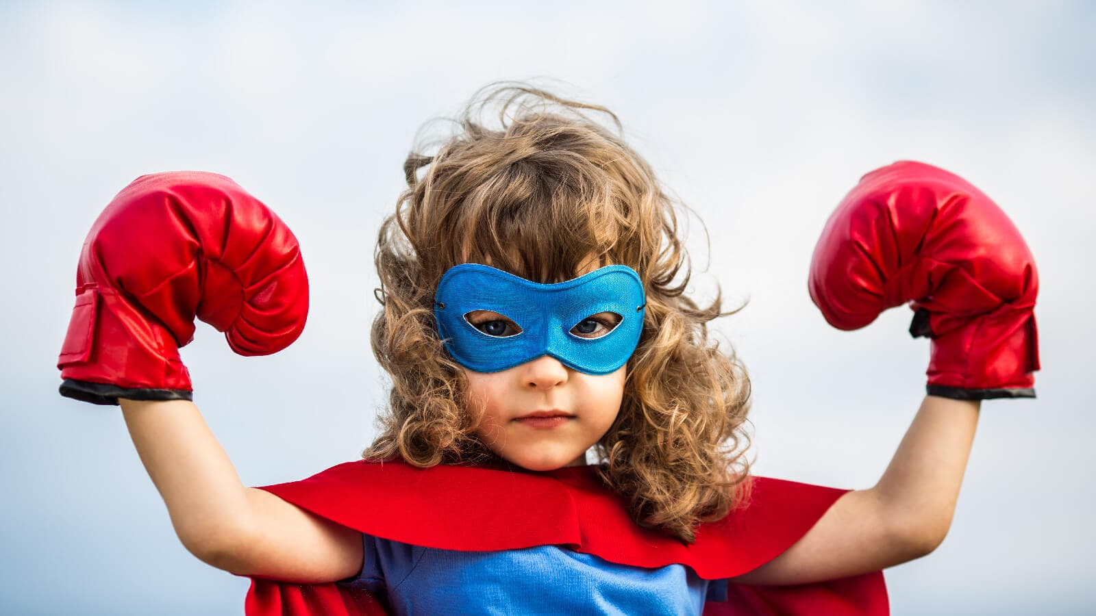 Young girl dressed as superhero