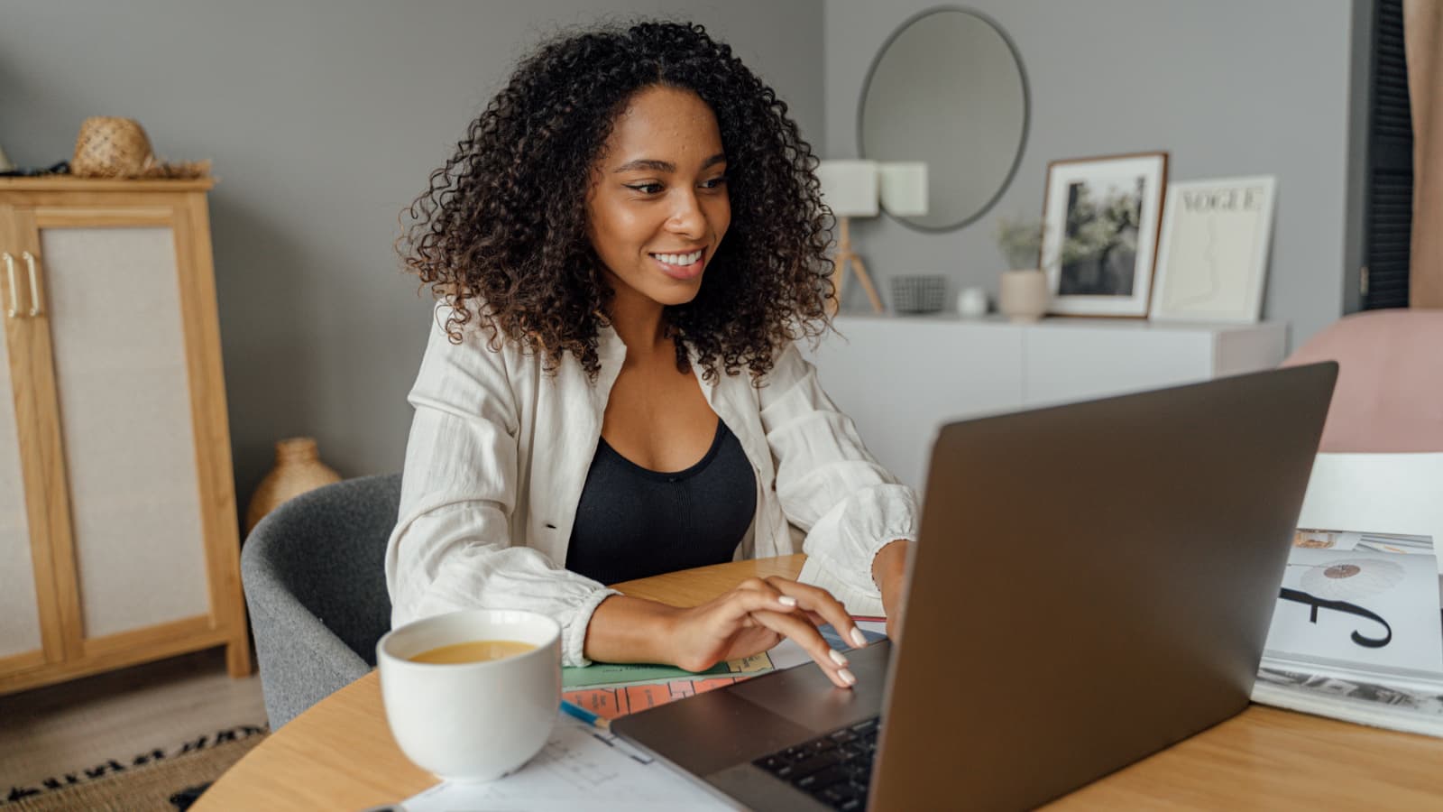Woman using laptop in home office