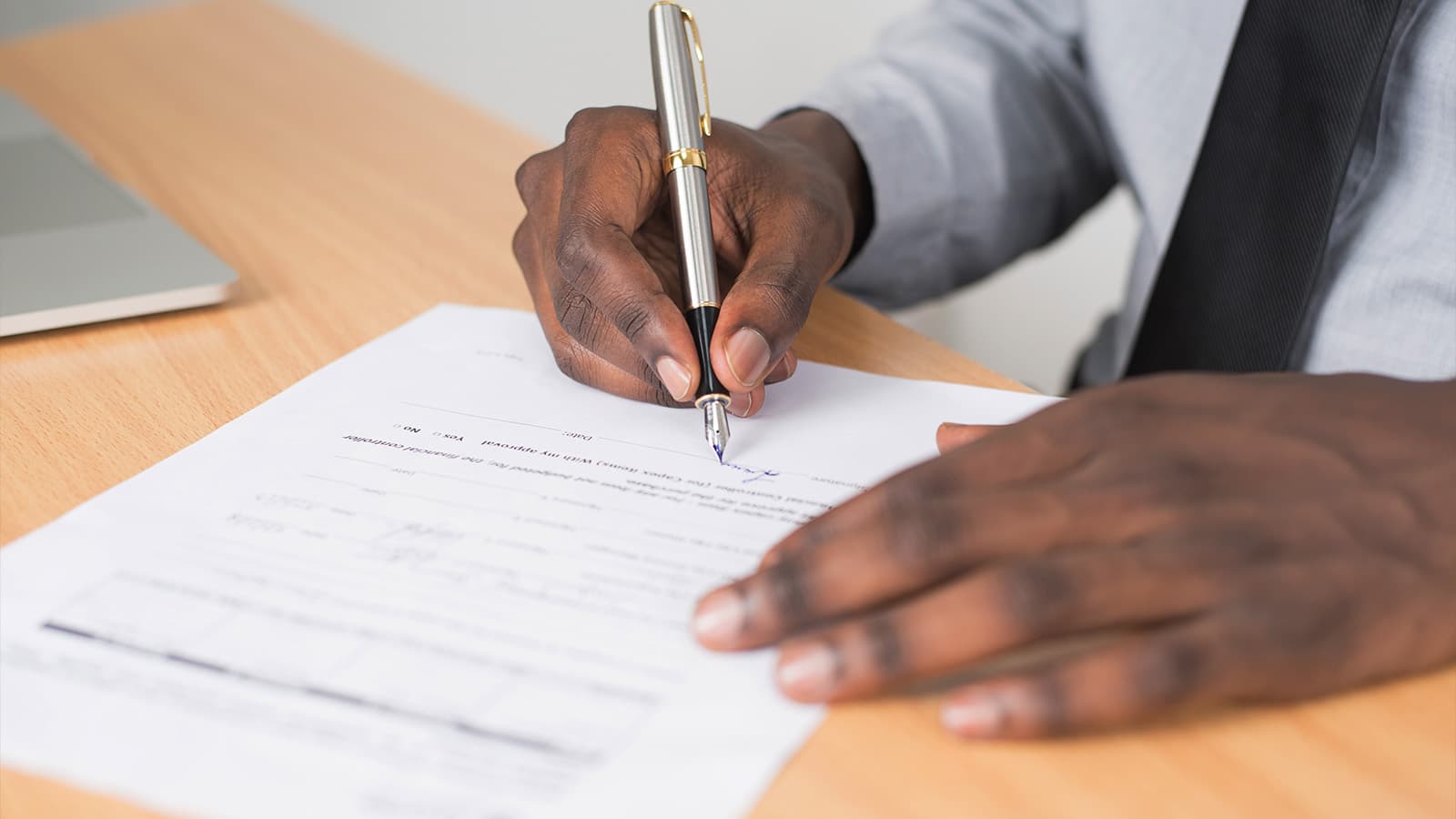 hands signing contract