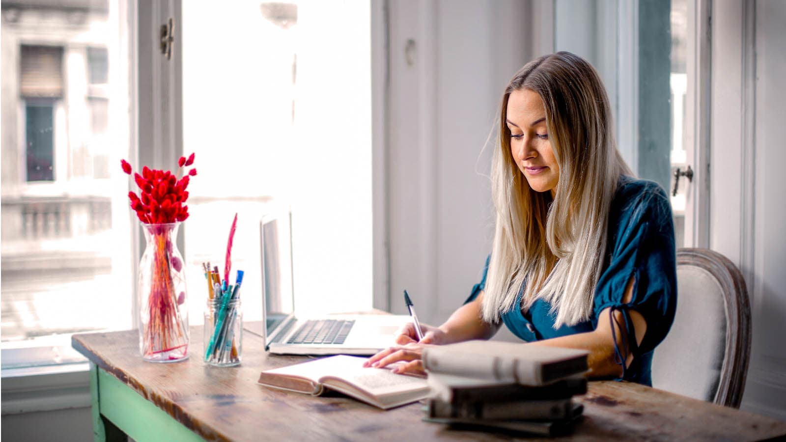 Woman sitting at tidy and organized desk