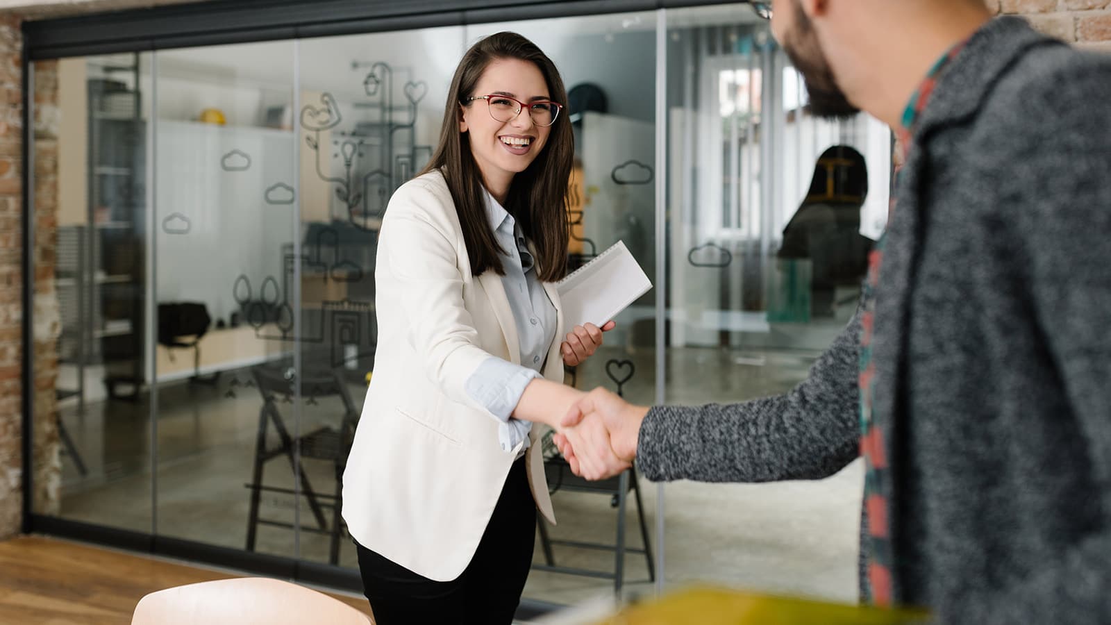 Man and woman shaking hands