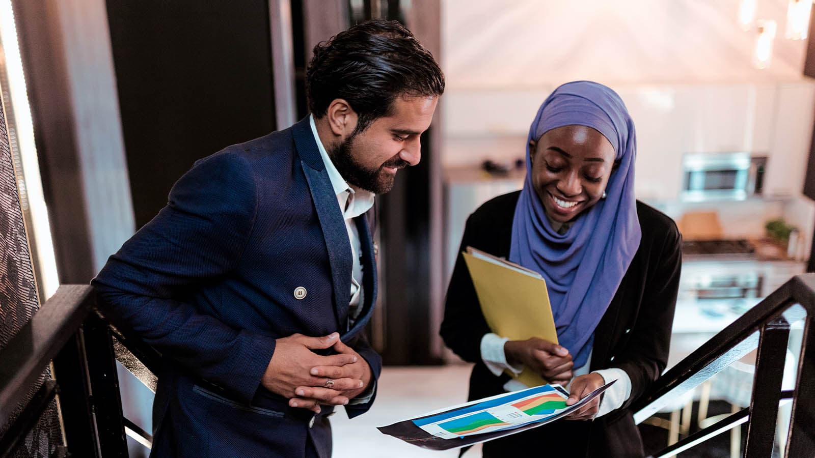 Man and woman looking at document