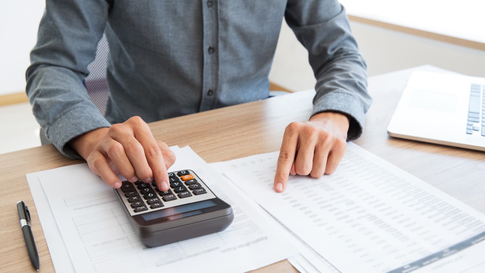 a man using a calculator