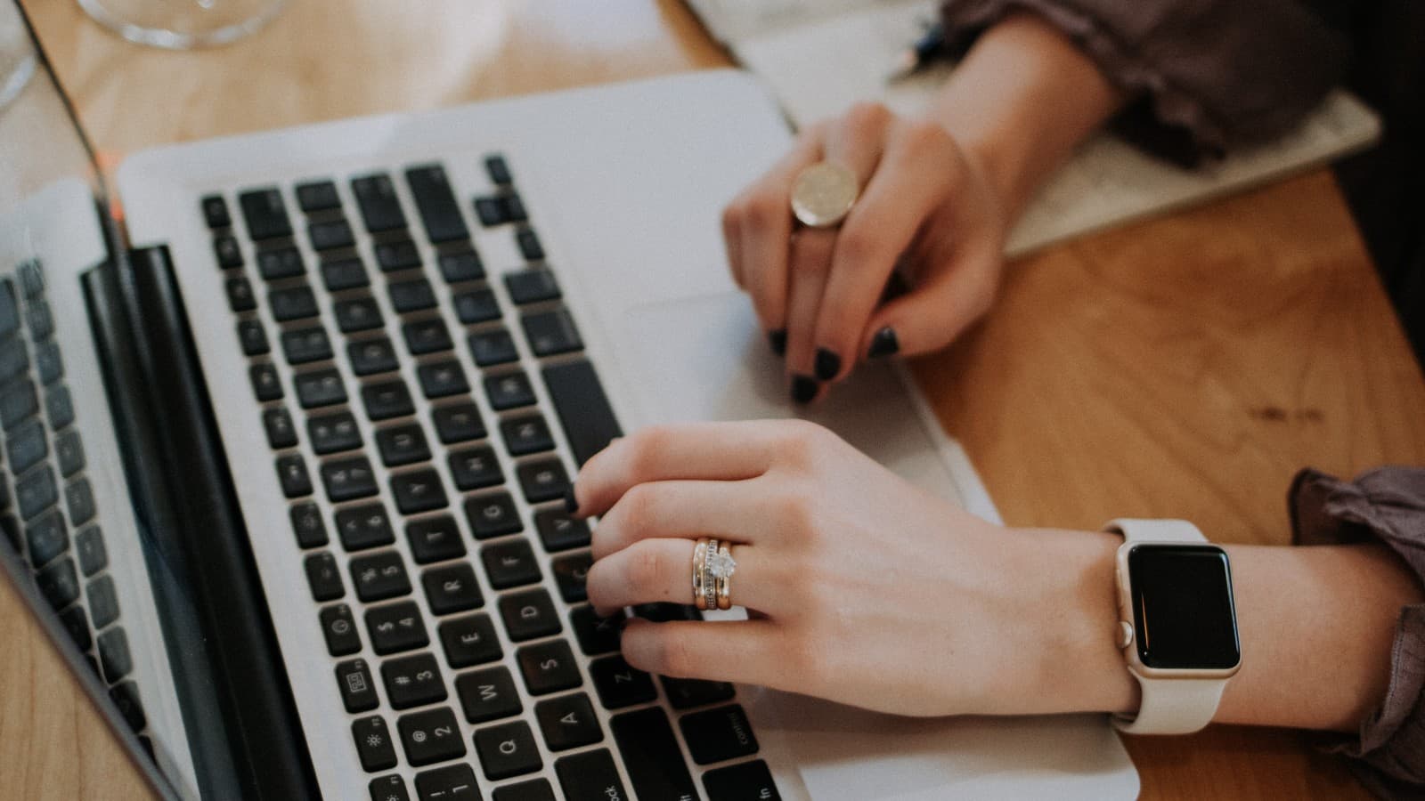 person typing on laptop