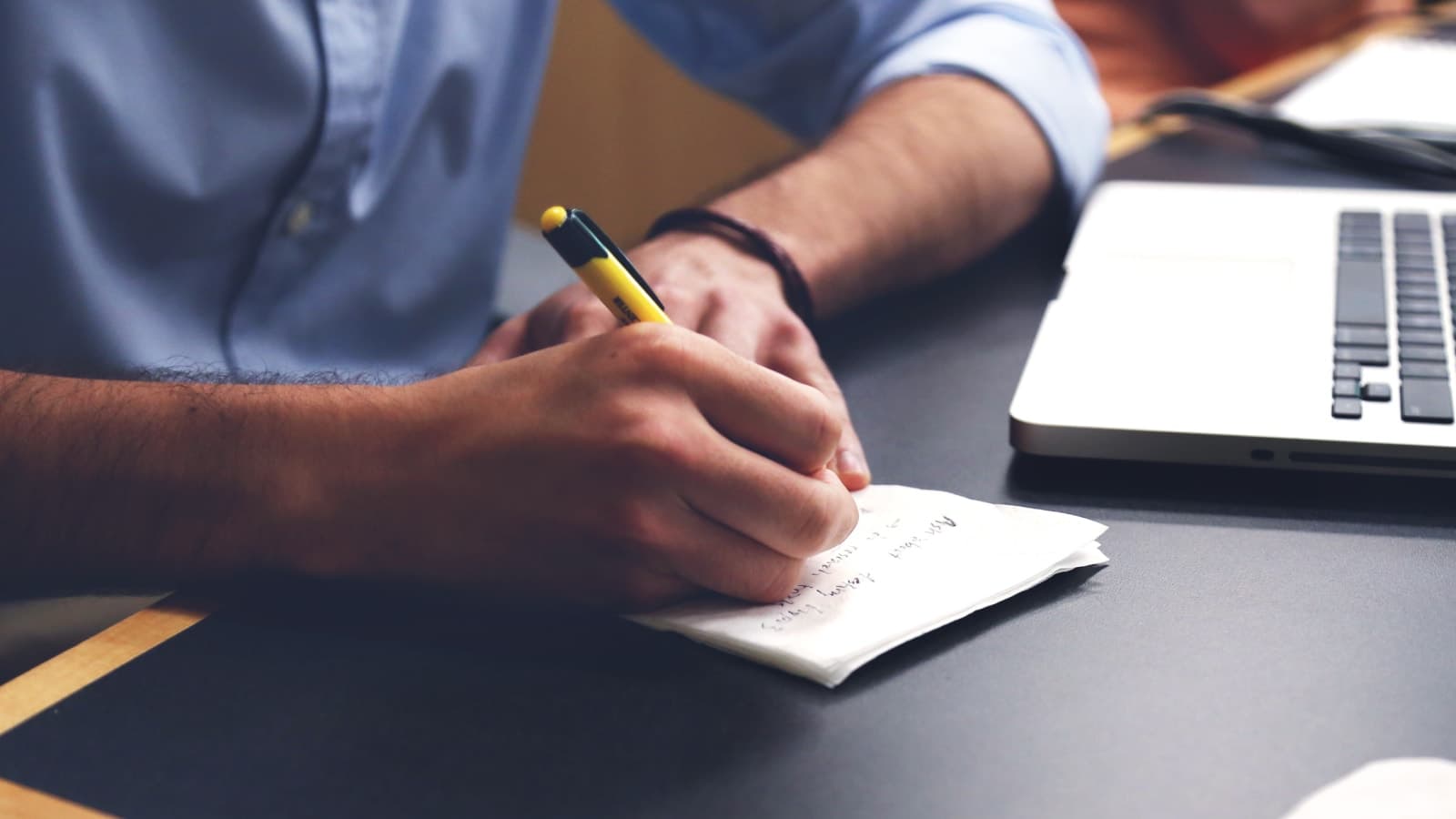 Man writing on a piece of paper
