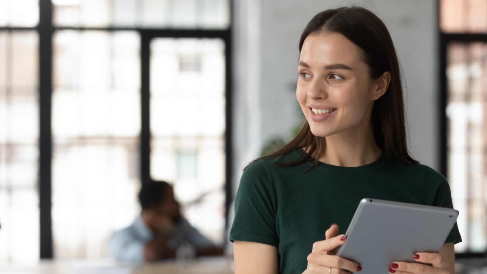 Young woman smiling at something out of shot