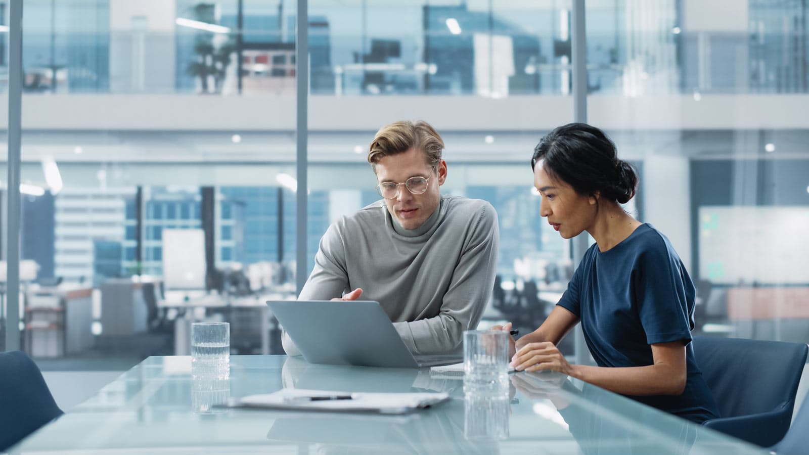 Man and woman having discussion at table