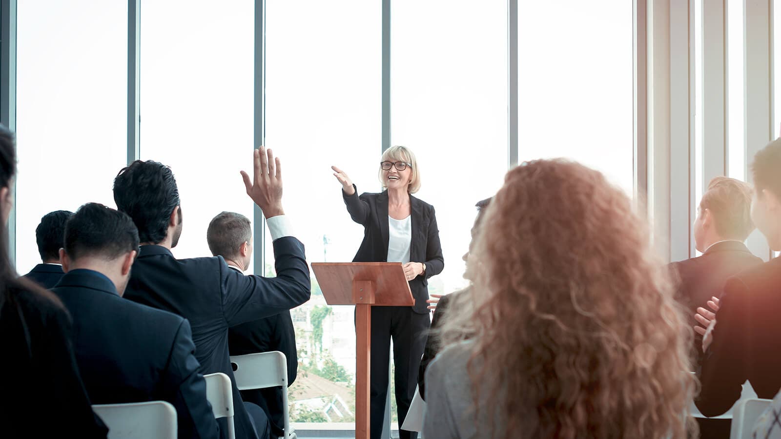 older woman leading a Q&A